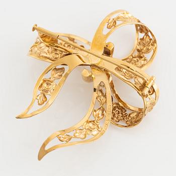 18K gold bow brooch.