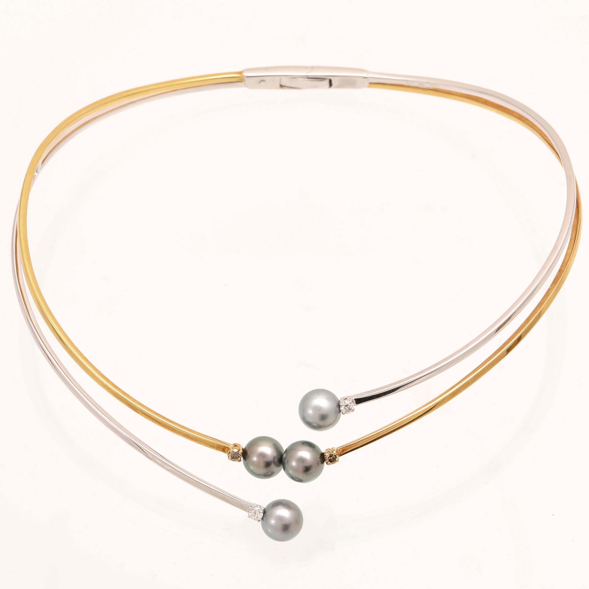 An 18K white- and yellow gold necklace with round brilliant cut diamonds and cultured Tahitian pearls, Damiani Italy.