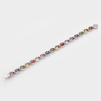 A multi-colour sapphire and diamond bracelet in 14K whitegold.