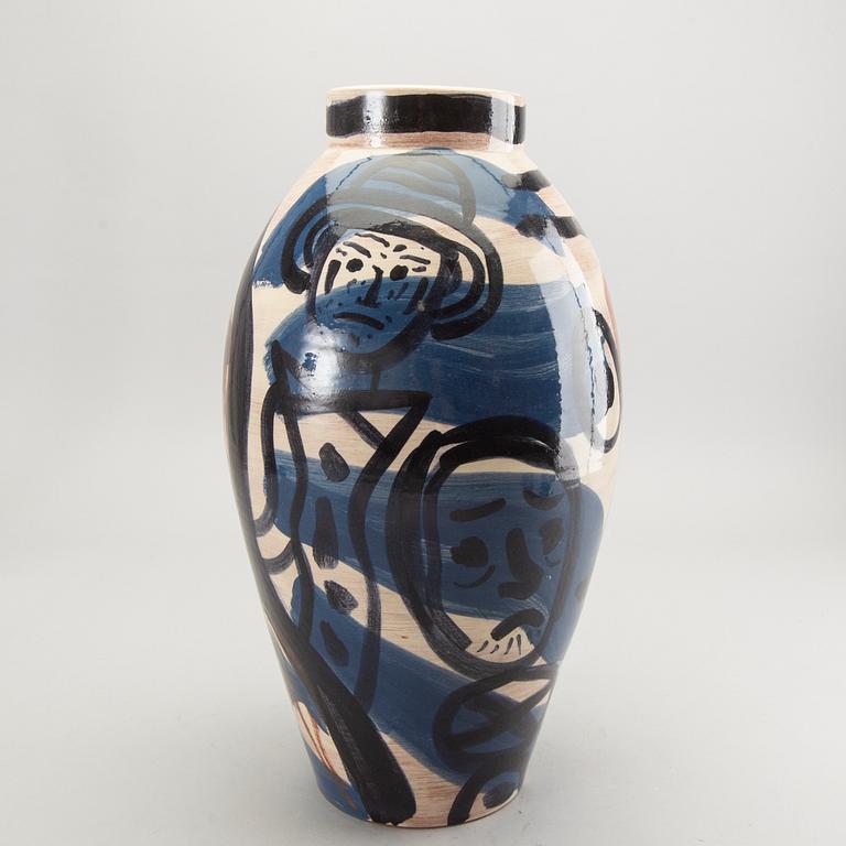 A glazed ceramic vase signed.