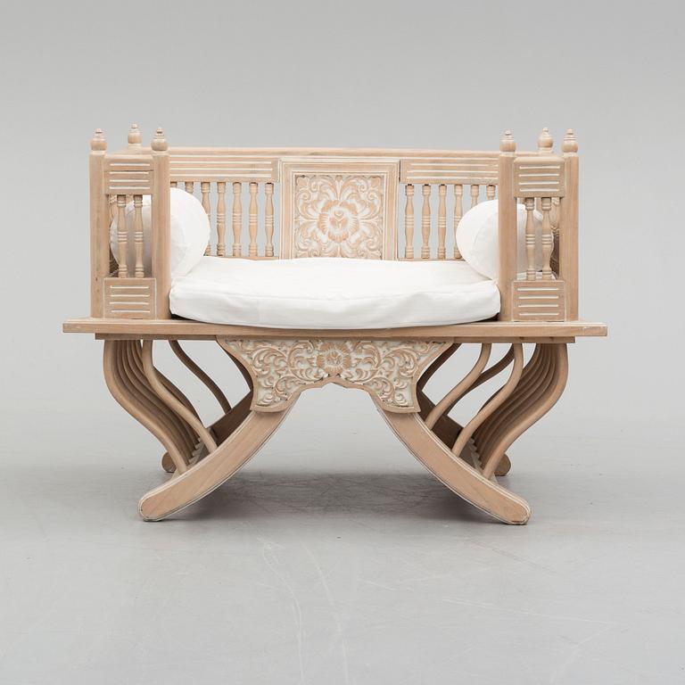 an elephant chair from the late 20th century.