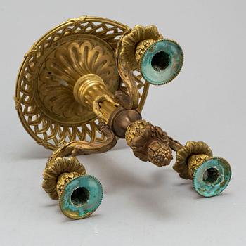 A Louis XVI-style bronze candelabrum, 20th century.