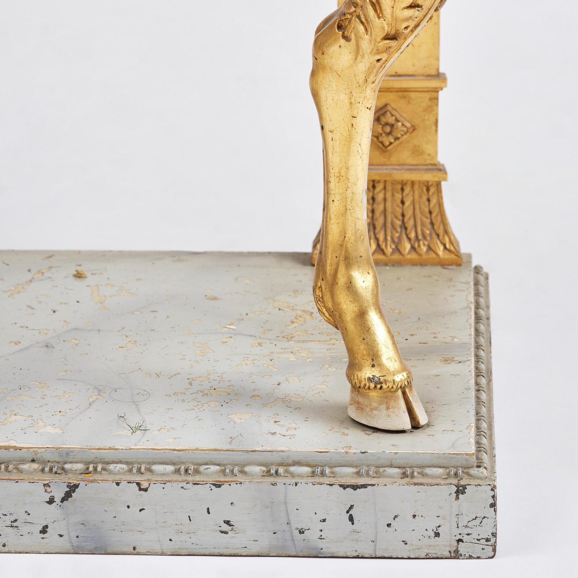A late Gustavian giltwood console in the manner of J. Frisk, Stockholm, early 19th century.