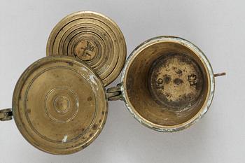 A brass set of measure, marked 1822.