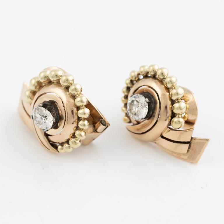 A pair of earrings in 14K gold set with old-cut diamonds.