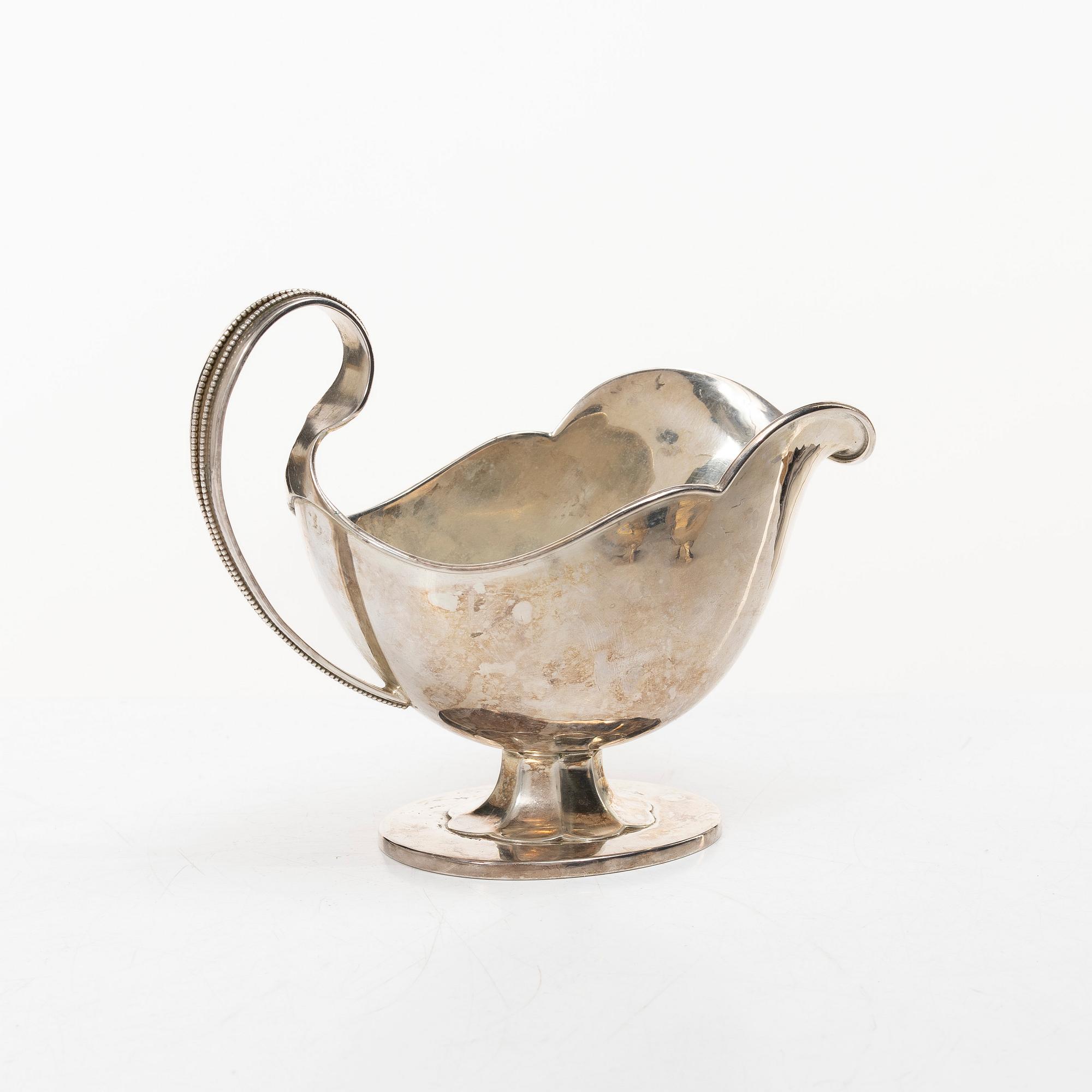 Sauceboat and four punch cups, silver, Sweden, 20th century.