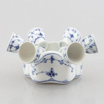A set with six egg servers, a stand and a salt shaker, "Blue fluted"/"Musselmalet", Royal Copenhagen, part 19th century.