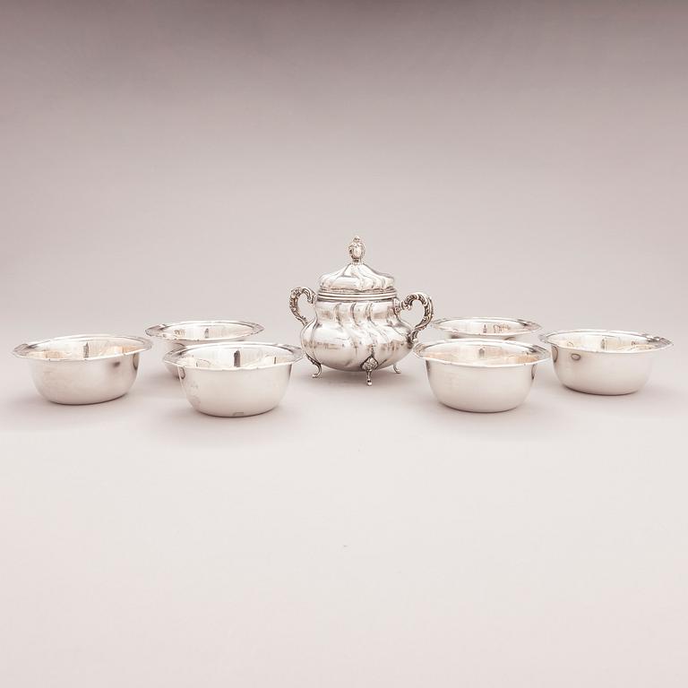A lidded silver sugar bowl and a set of six silver bowls, Germany.