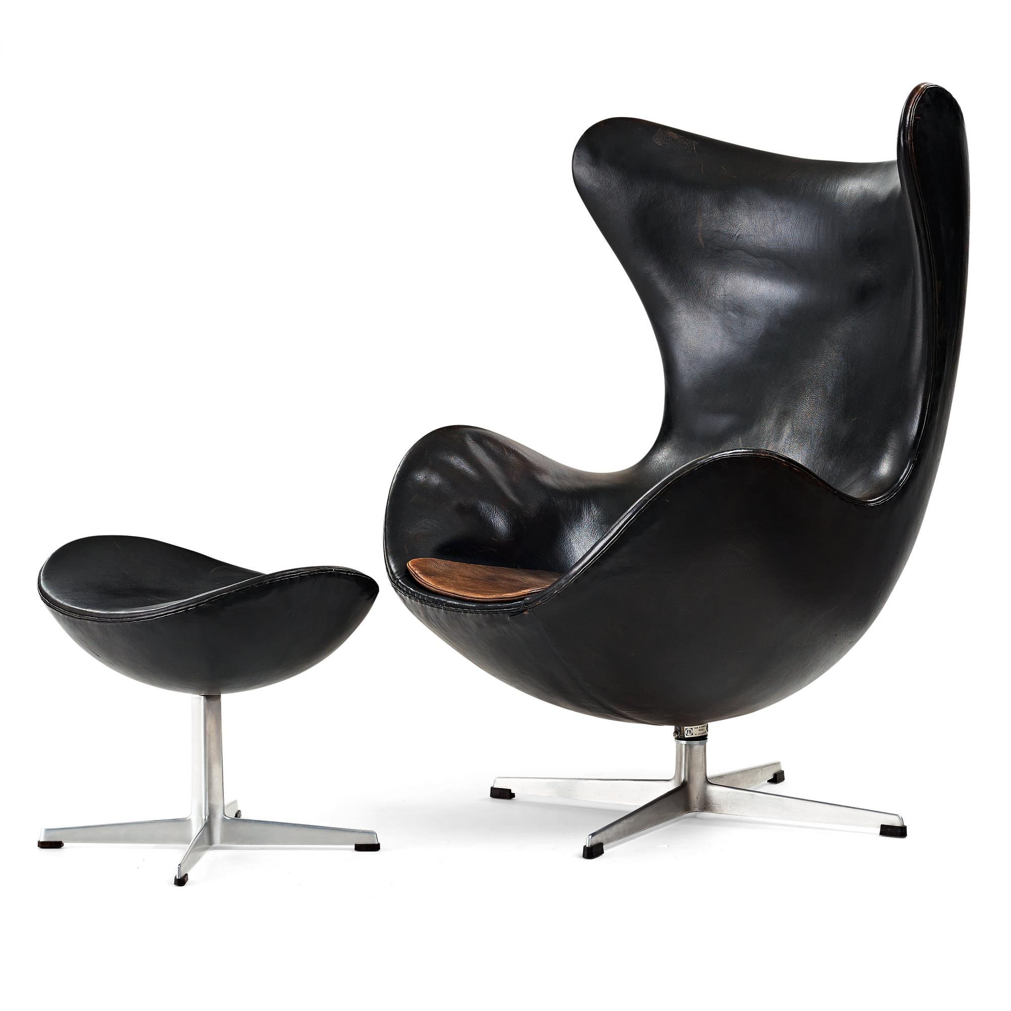 ARNE JACOBSEN, a black leather "Egg" chair with ottoman, Fritz Hansen, Denmark 1960's.