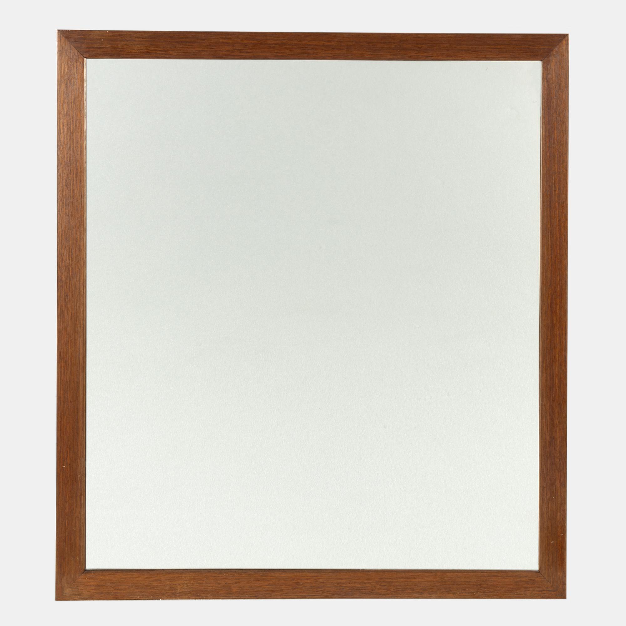 Firma Svenskt Tenn, a mahogany framed mirror, mid 20th century.