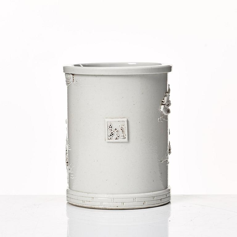 A white glazed Chinese brush pot, presumably late Qing dynasty.