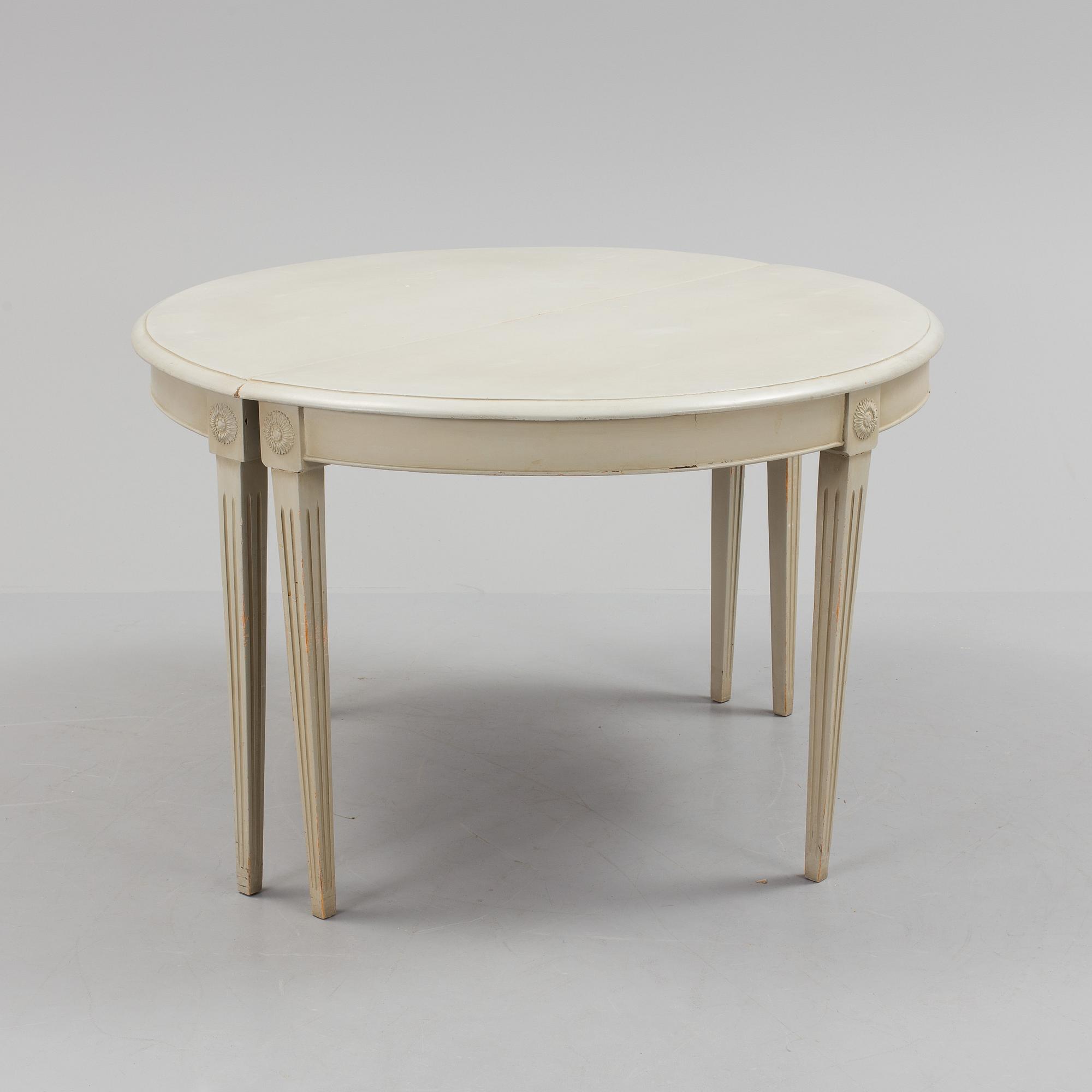 A lot of four mid 20th century Swedish Gustavian style chairs and one dinner table from around year 1900.