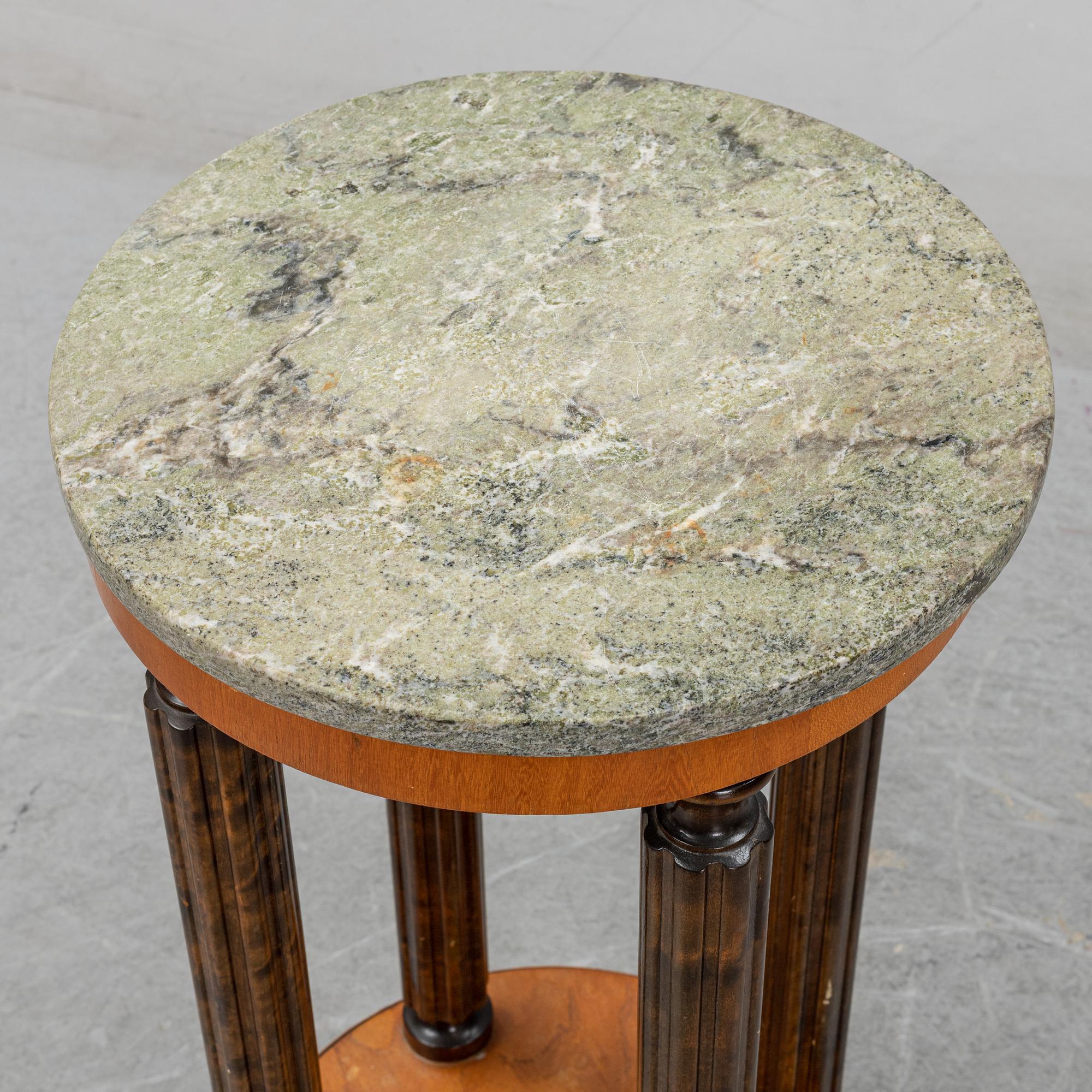 A stone top pedestal, 1920's/30's.