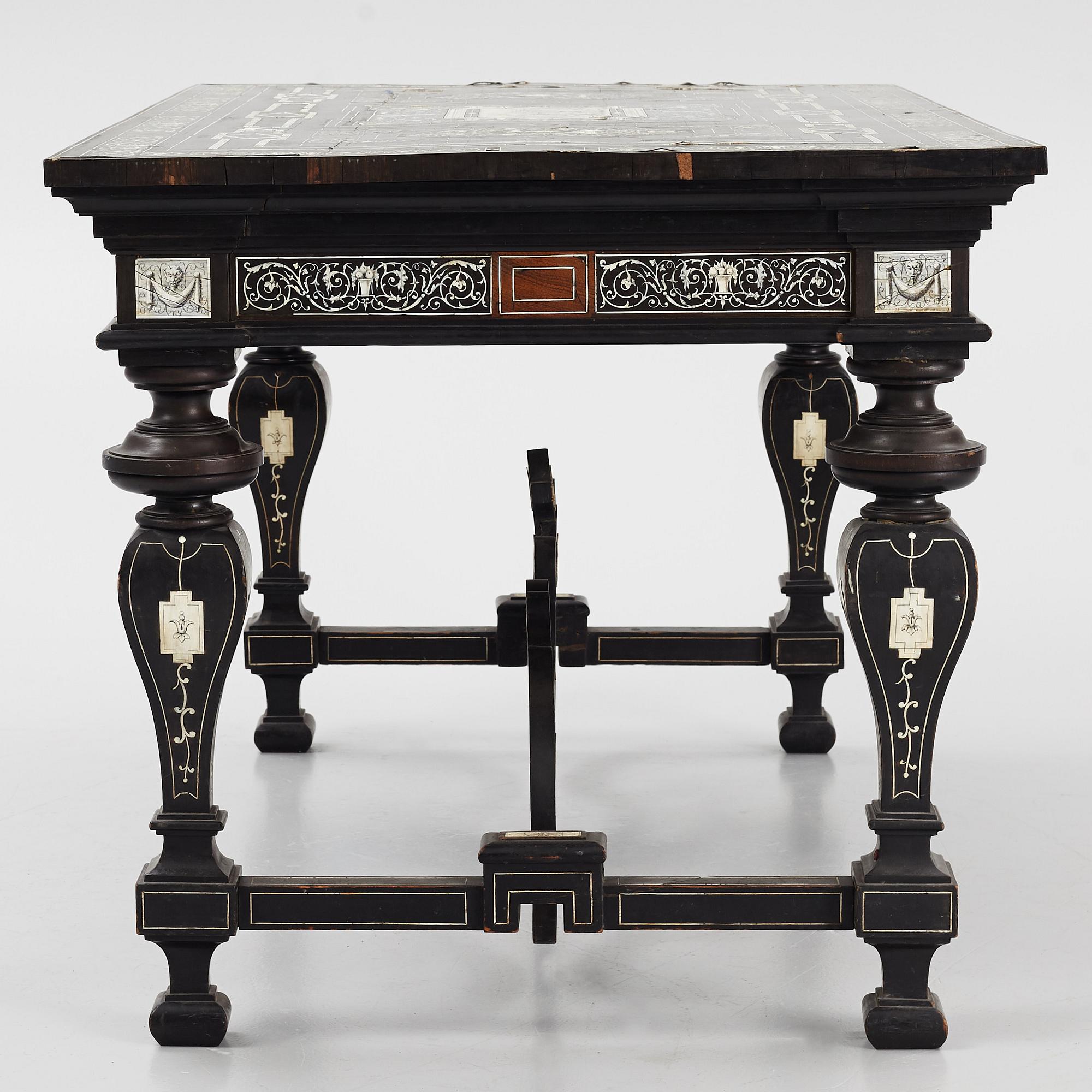 A Renaissance-style ebony, ebonized and ivory-inlaid library table, late 19th century, presumably Germany.