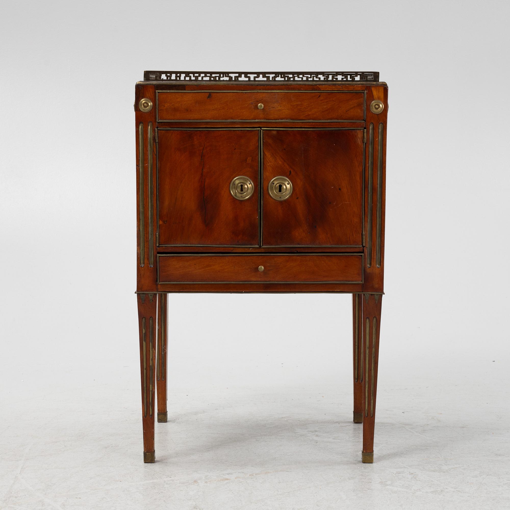 A late Gustavian mahogany-veneered chamberpot cupboard, late 18th century.