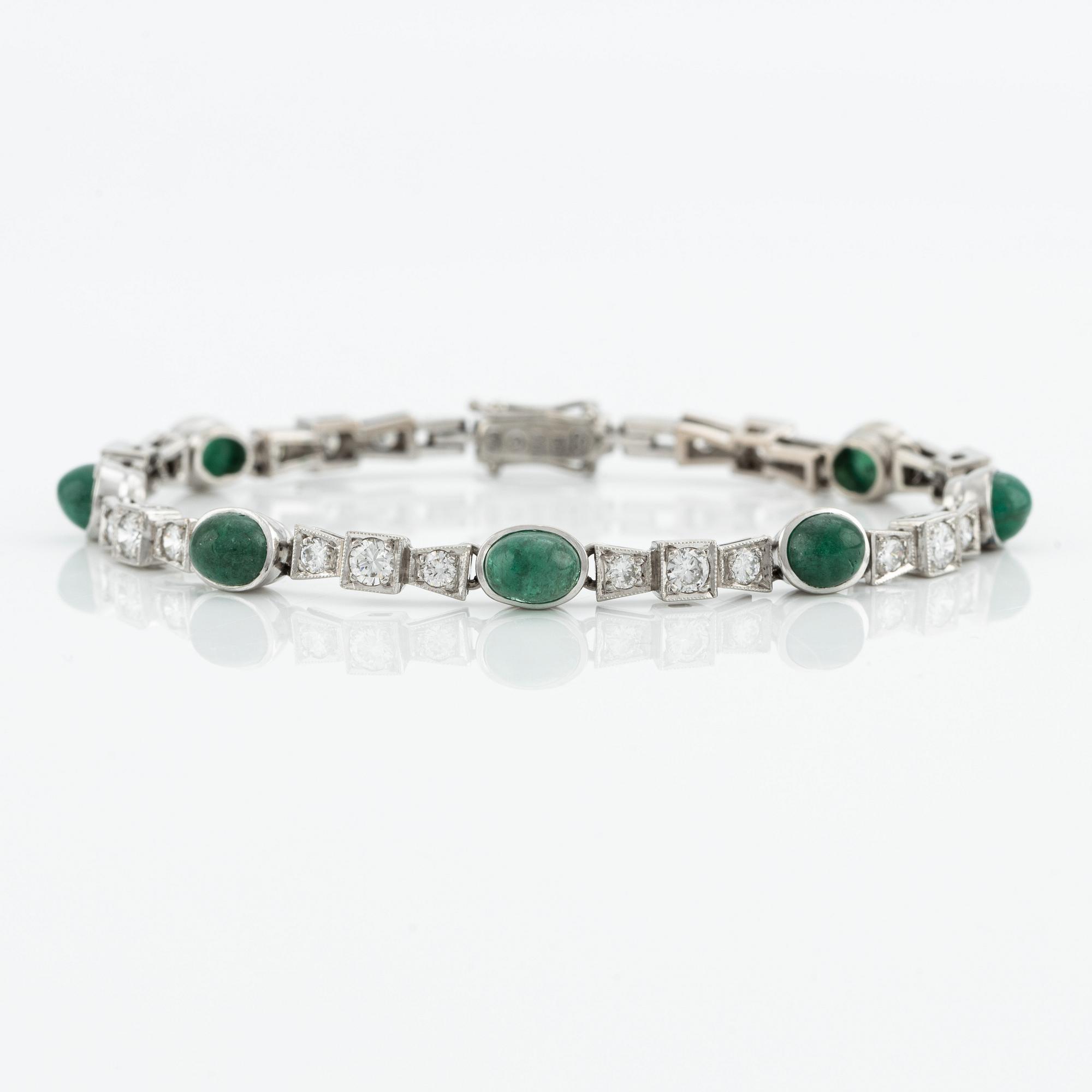 Bracelet, 18K white gold with cabochon-cut emeralds and brilliant-cut diamonds.