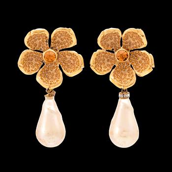 A pair of earrings by Yves Saint Laurent.