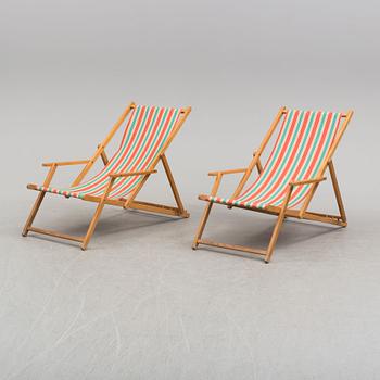 A pair of mid 20th century beech sun chairs.