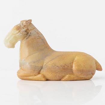 A carved nephrite figure of a reclining horse, 20th Century.