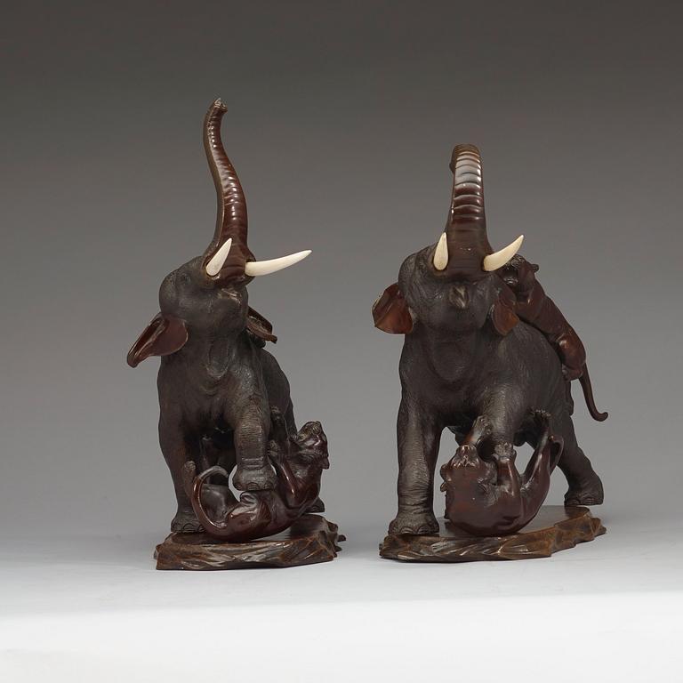 A pair of Japanese bronze sculptures of elephants, late Meiji (1868-1912).