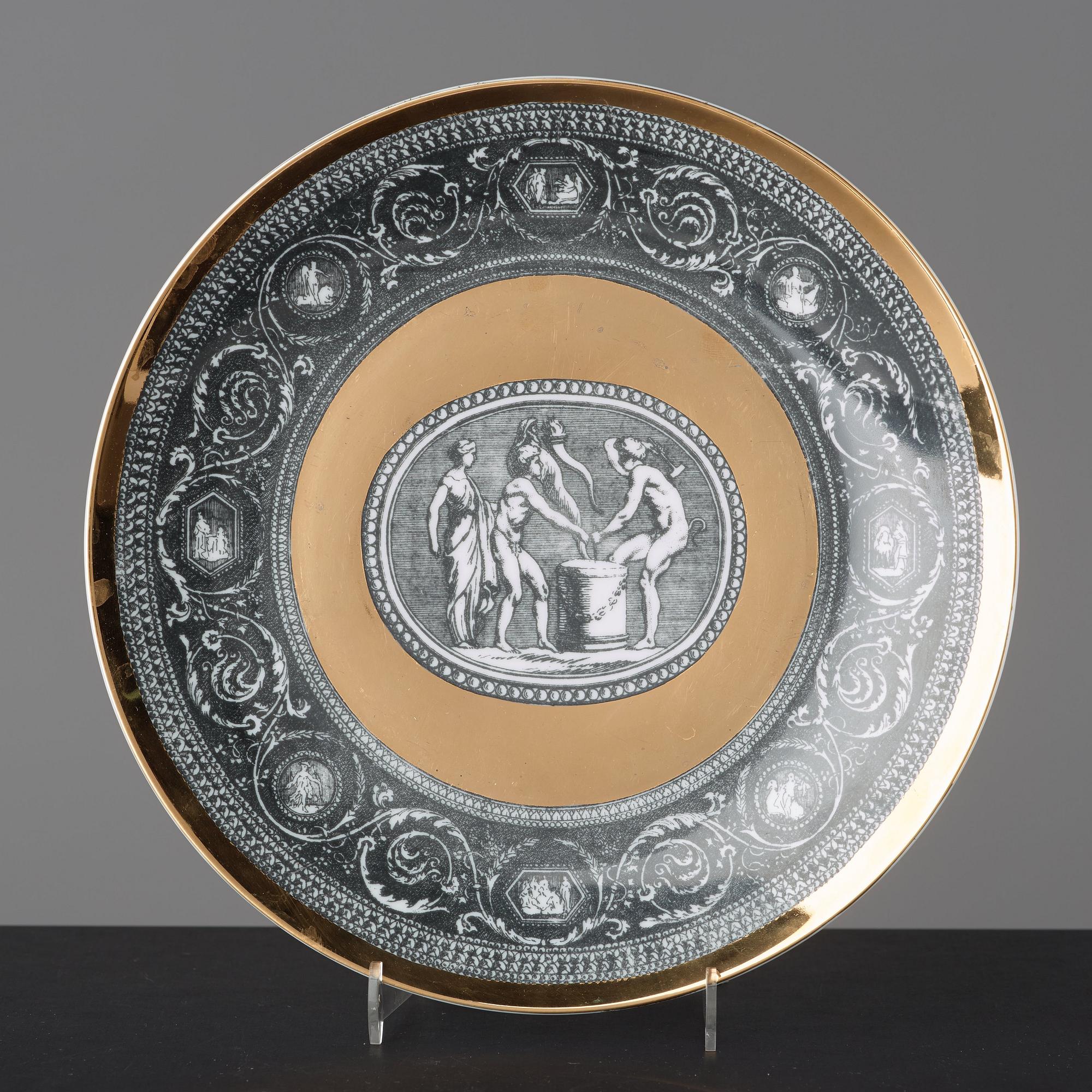 Piero Fornasetti, a set of six "Cammei" porcelain plates, Milano, Italy.