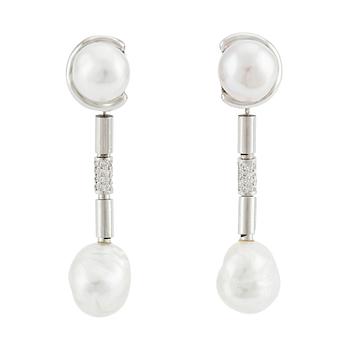 A pair of Gaudy earrings with platinum pendants  with cultured pearls and round brilliant-cut diamonds.