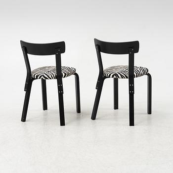 Alvar Aalto, a dining table and eight chairs, model 69, Artek, Finland, end of the 20th century.