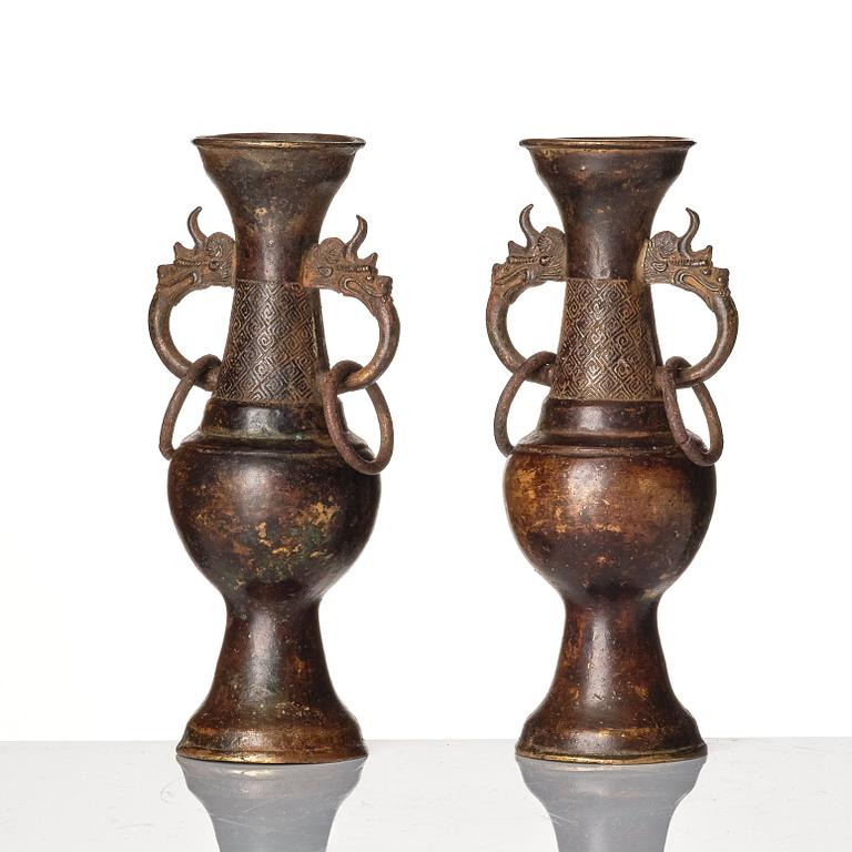 A pair of bronze altar vases, Ming dynasty (1368-1644).