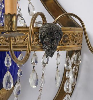 A pair of Russian Louis XVI-style  four-branch gilt bronze appliques, 19th century.