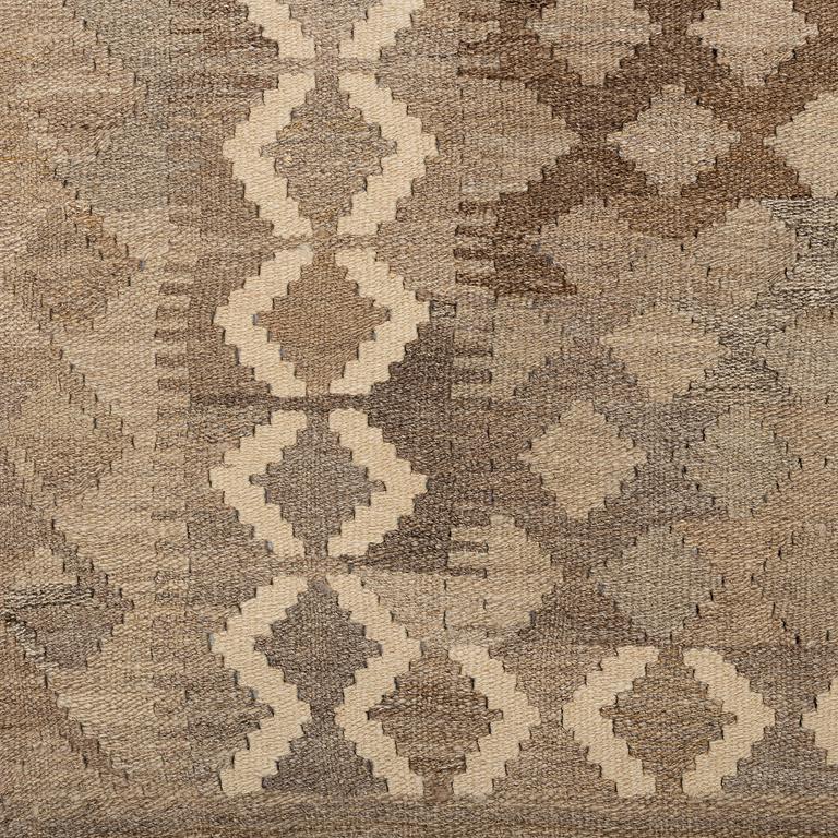 A carpet, kilim, around 254 x 160 cm.