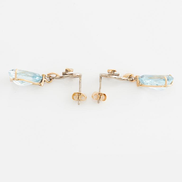 Earrings with pear-shaped topazes and brilliant-cut diamonds.
