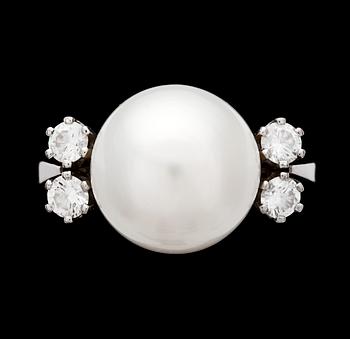 1062. A cultured pearl, 12 mm, and diamond ring, 1980's.