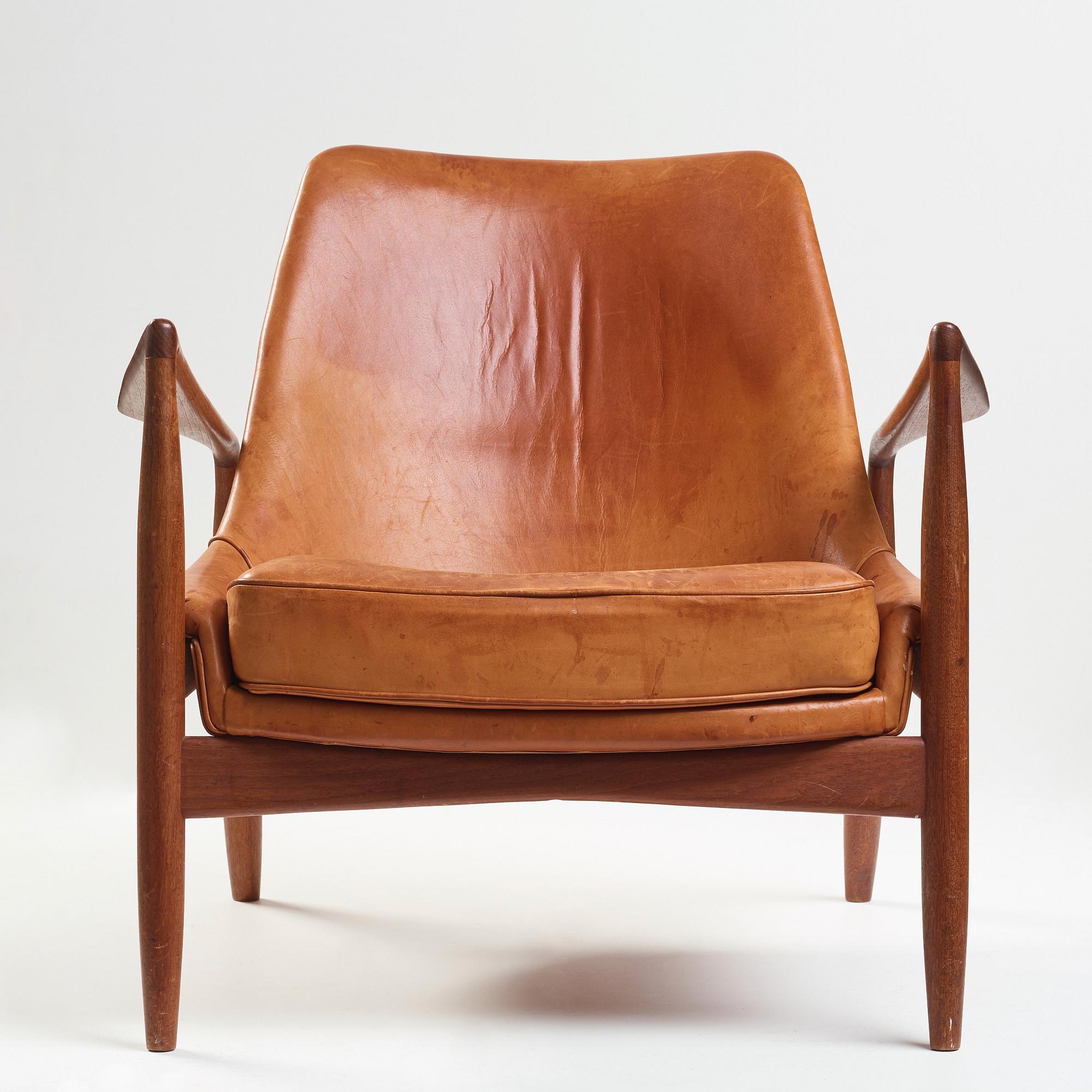 Ib Kofod-Larsen, a "Seal" teak and brown leather armchair, Olof Persson Möbler, Jönköping, Sweden 1950-60's.