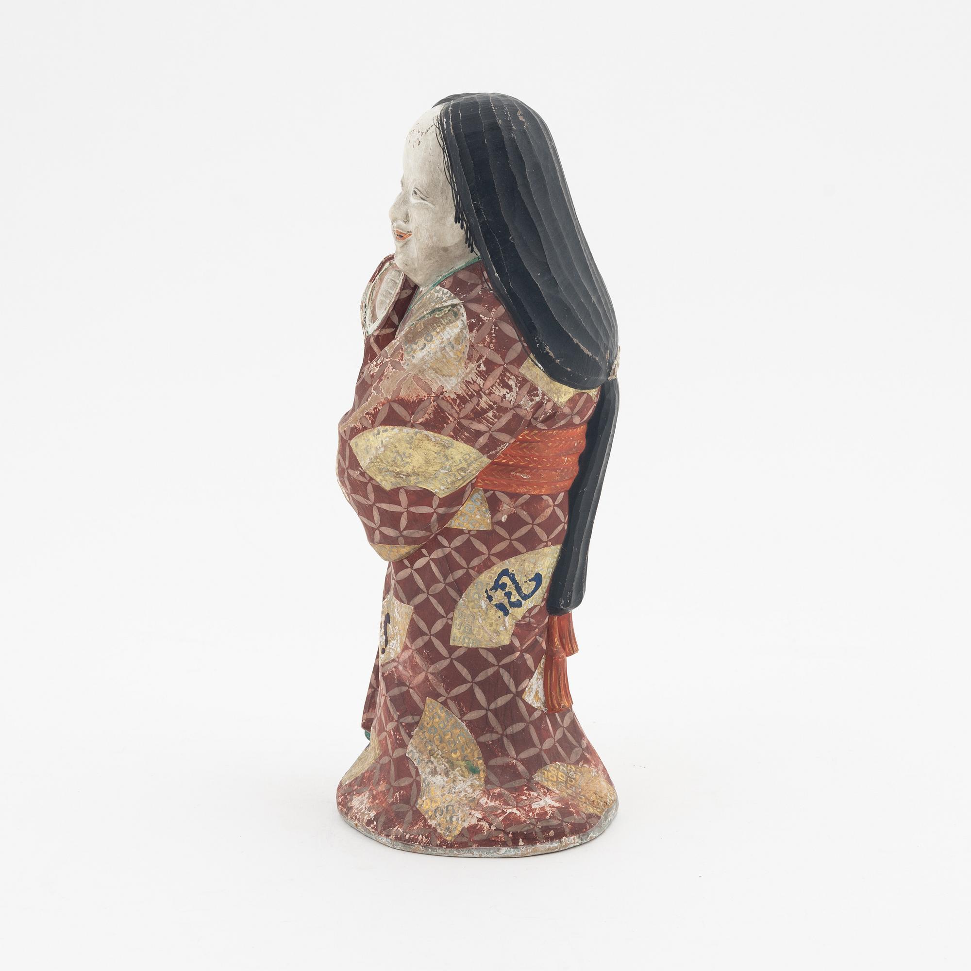 A Japanese wooden sculpture, 20th Century.
