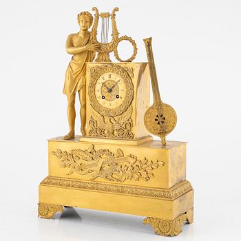 A French Empire ormolu figural mantel clock, early 19th Century.