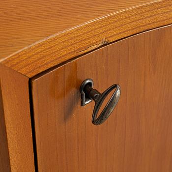 A corner bookcase, three sections, 1940's.