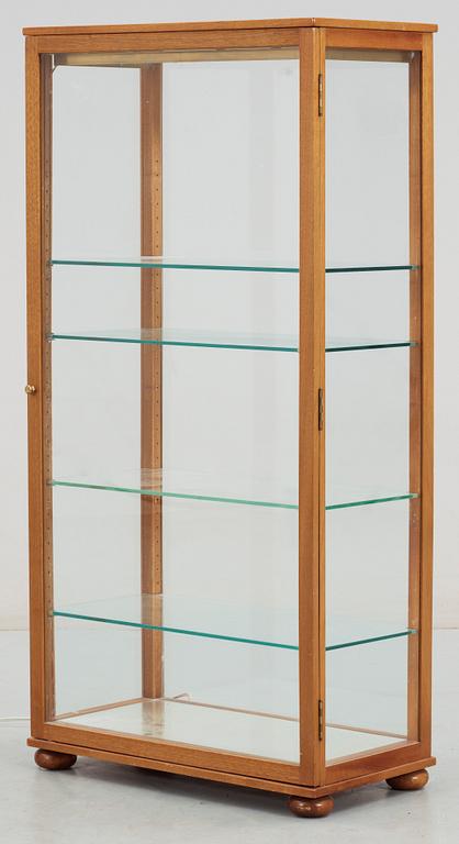 A Josef Frank mahogany and glass cabinet by Svenskt Tenn, model 649.