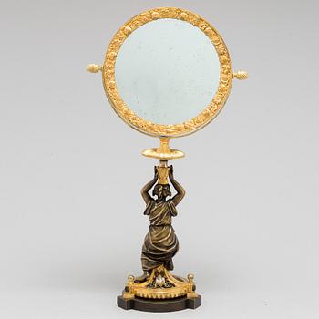 AN EMPIRE ORMOLU TABLE MIRROR, first half of the 19th century.