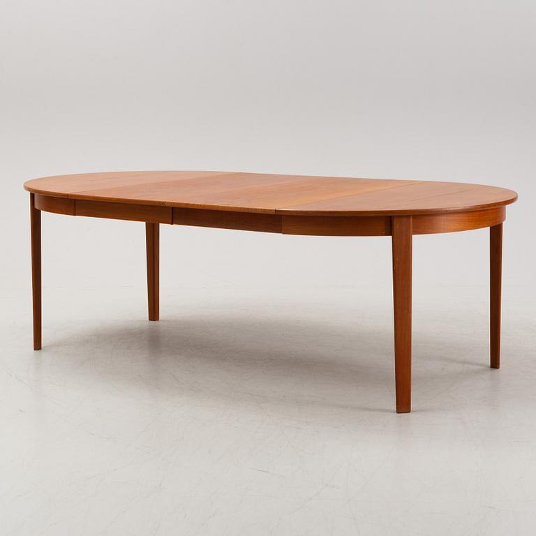 A 1950's/60's teak-veneered dining table.