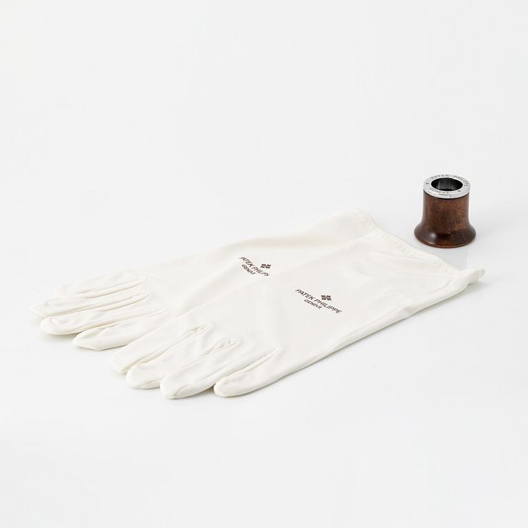 Patek Philippe, loupe, gloves.