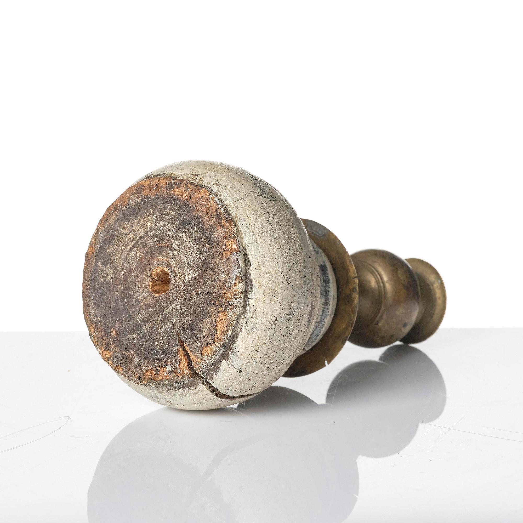 A Northern European baroque candlesticks, late 17th century, with a repaired wooden base.