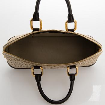 Louis Vuitton, a 'Monogram Mini Lin Alma Long Handbag'.