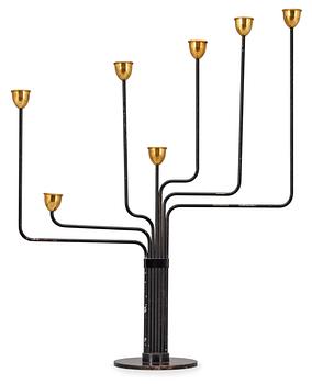 23. A Piet Hein brass and black lacquered metal candelabrum, 1950's-60's.