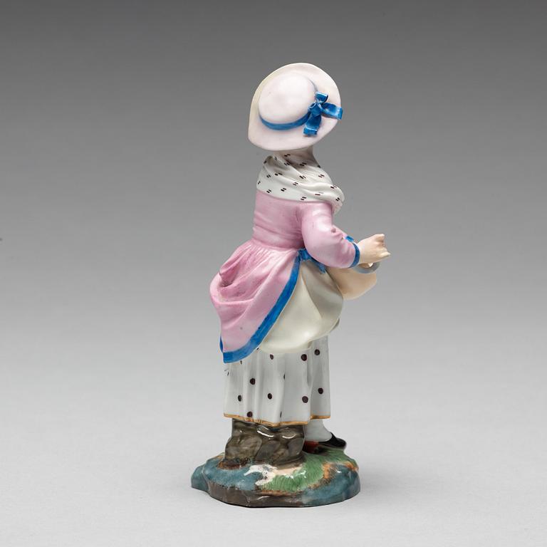 A porcelainfigure of a female musician, "Höchst mark", circa 1900.
