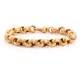 467. An 18K gold Tännler bracelet.