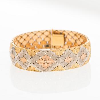 A BRACELET, 18K gold in three colours.