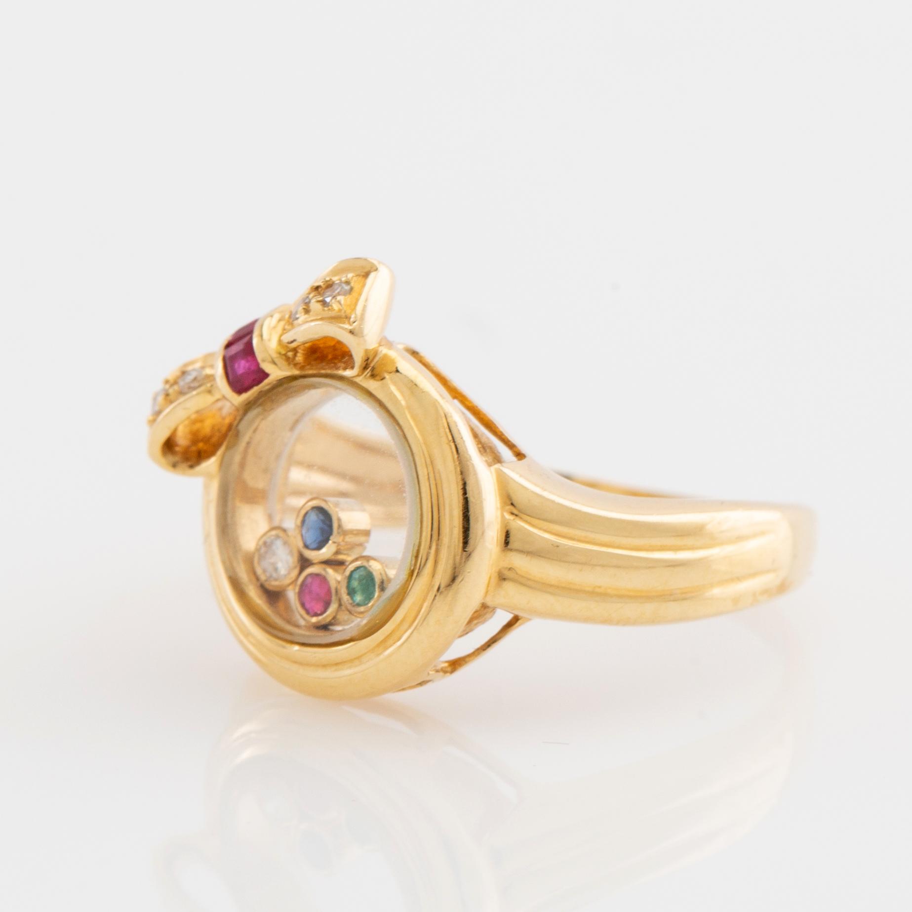 Ring, 18K gold with brilliant-cut diamonds, rubies, emerald, and sapphire.