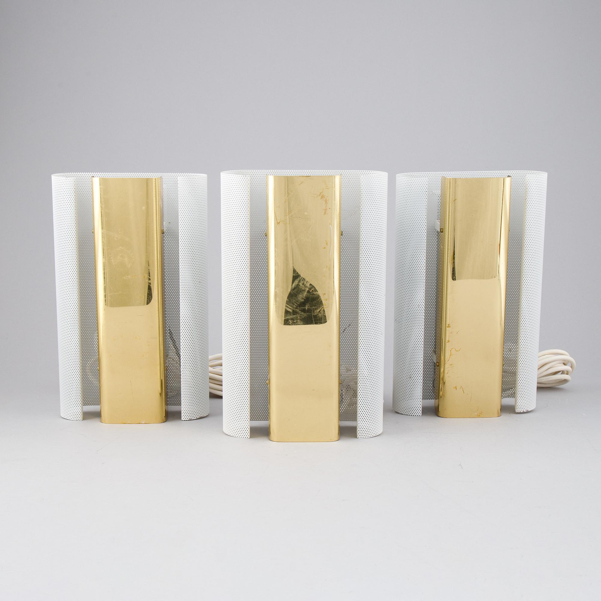 Hans-Agne Jakobsson, a set of three of 'V-451/18L'/'Rasputin' brass wall lights from Markaryd.