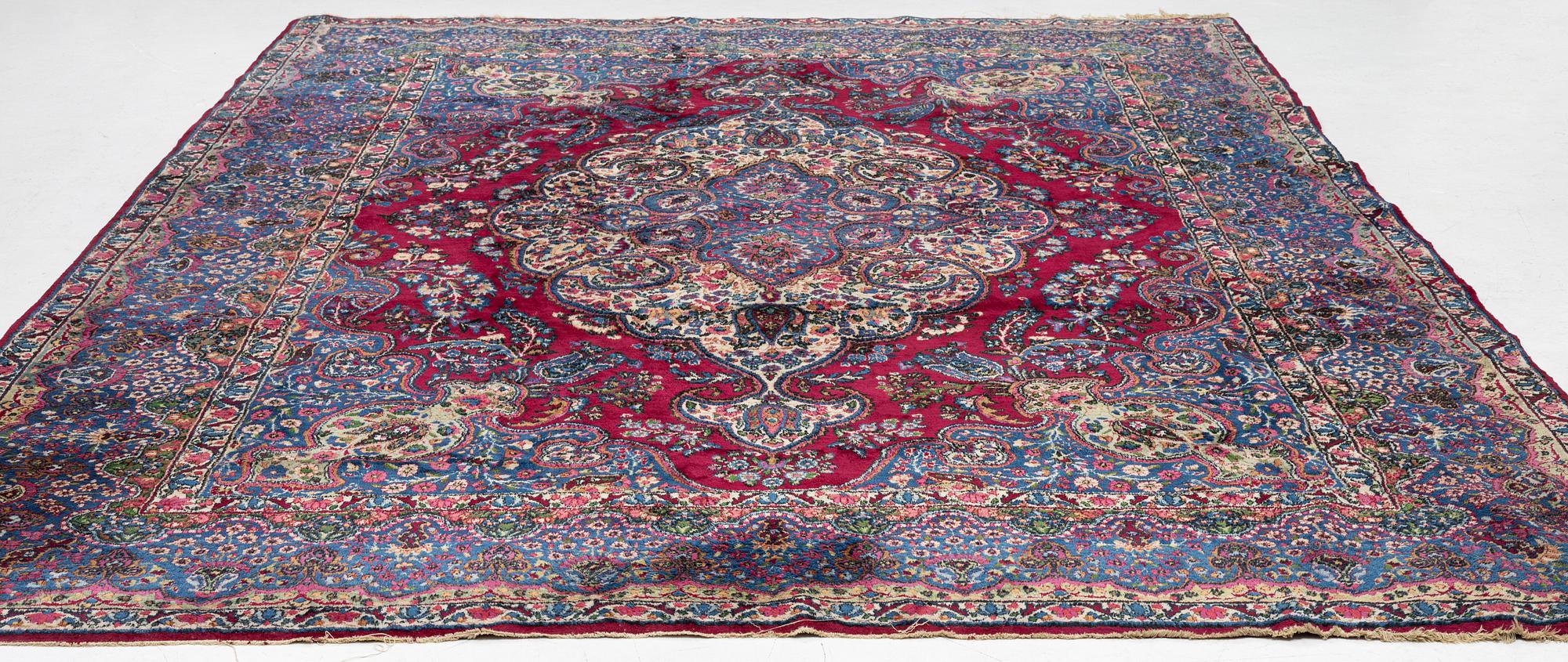 A Kerman carpet, c. 365 x 265 cm.