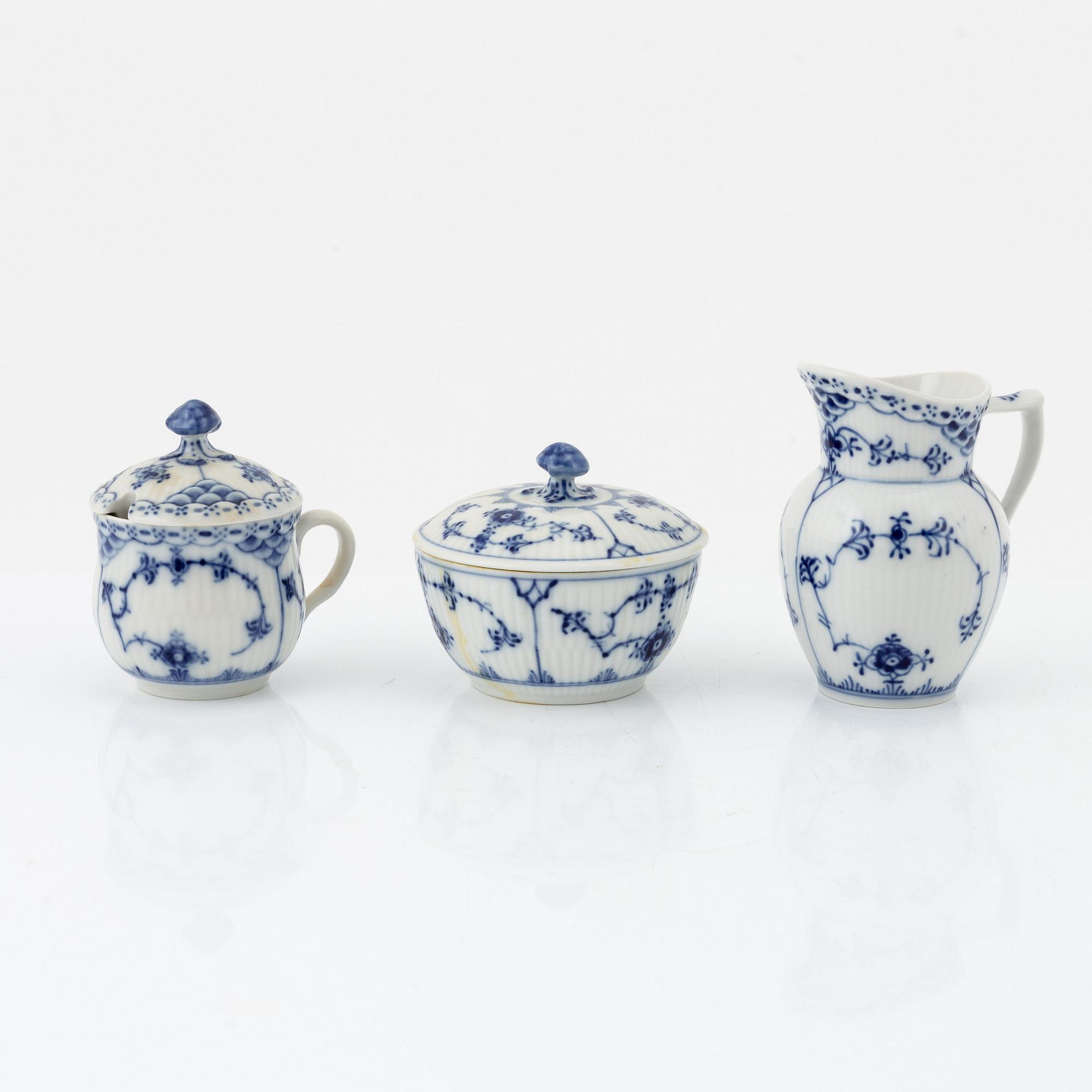 A 24-piece 'Musselmalet' tea service, Rifflet and half lace, Royal Copenhagen, Denmark.